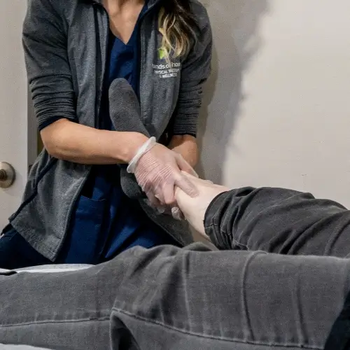 Therapist performing lymphatic drainage massage on patient